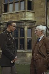 Lieutenant James F Gaylor of the 8th US Army Air Force talking with Sir William Beveridge at University College Oxford during WWII tea party