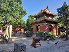 Beijing Dongyue Temple main hall with traditional Chinese architecture under a blue sky