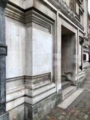 Architectural detail of Methodist Central Hall showing ornate stone carvings and grand archways