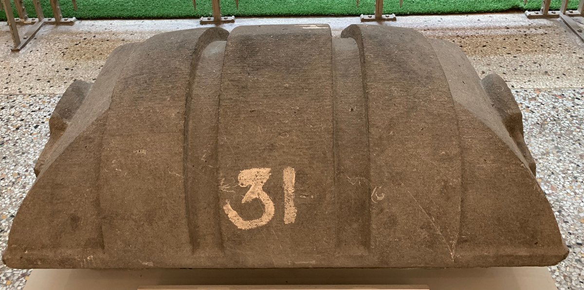 Large granite block weighing 700 kg from the Maison du Peuple in Brussels, dated 1899, displayed at the Belgian Comic Strip Center