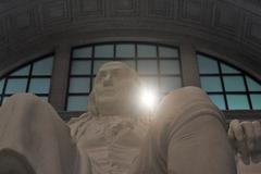 Statue of Benjamin Franklin in the main hall of the Franklin Institute viewed from below