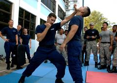 U.S. Coast Guard Maritime Law Enforcement Specialists demonstrating tactical procedures to Malaysian Maritime Enforcement Agency team