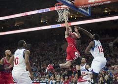 Doug McDermott of Chicago Bulls going for a layup in basketball game against Philadelphia 76ers
