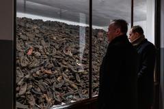 Second Gentleman Douglas Emhoff observing a display of shoes from Auschwitz-Birkenau concentration camp