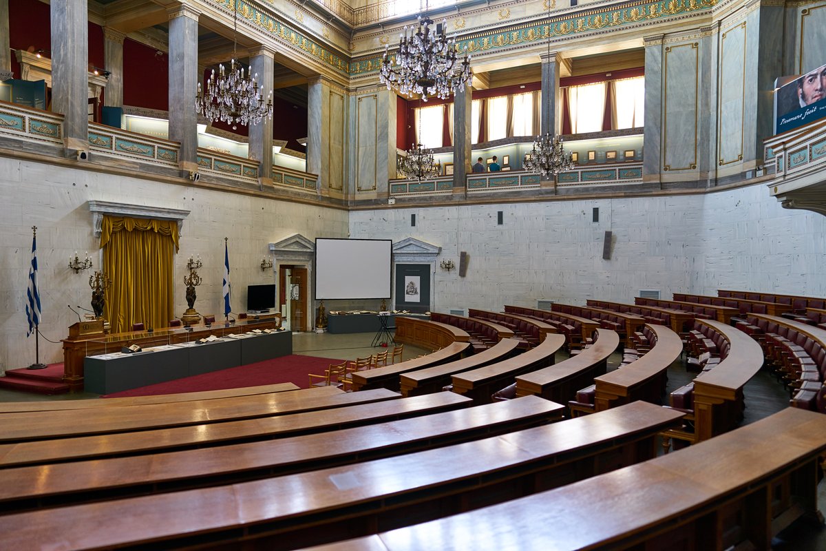 Interior of the Old Parliament House in Athens with historic artifacts and displays