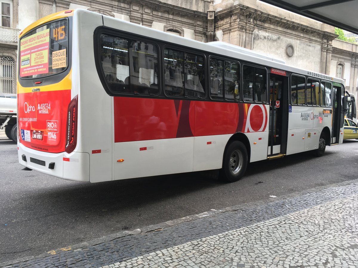 Bus of line 415 by Auto Viação Alpha at Praça Pio X in front of Igreja da Candelária, downtown Rio de Janeiro, Brazil