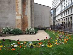 Garden behind Saint Bonaventure Church in Lyon with green grass and pathway