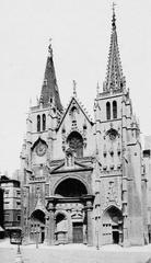 Front view of Église Saint-Nizier church in Lyon with a cloudy sky