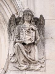 South bell tower facade of Saint-Nizier Church with right angel statue in Lyon