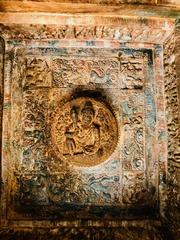 7th to 8th century concentric circle murals with green, blue, white and red shades on ceiling and pillars at Badami cave temples Karnataka