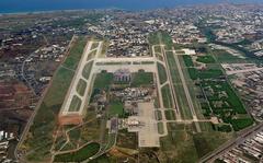 Antalya Airport terminal building and airplanes on the runway