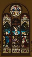 Stained glass window depicting the crucifixion scene inside the Holy Family Church in Bytom-Bobrek