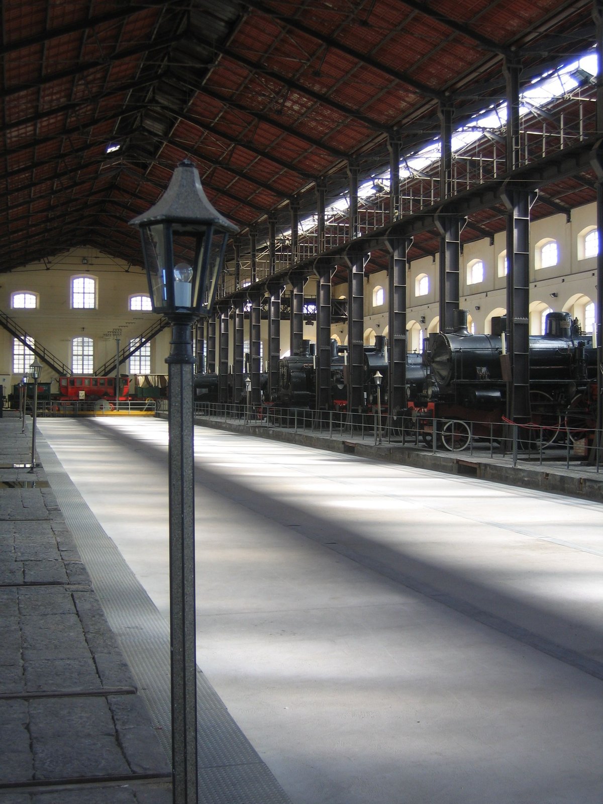 Main hall of Pietrarsa Railway Museum with historic locomotives from the second half of the 19th century