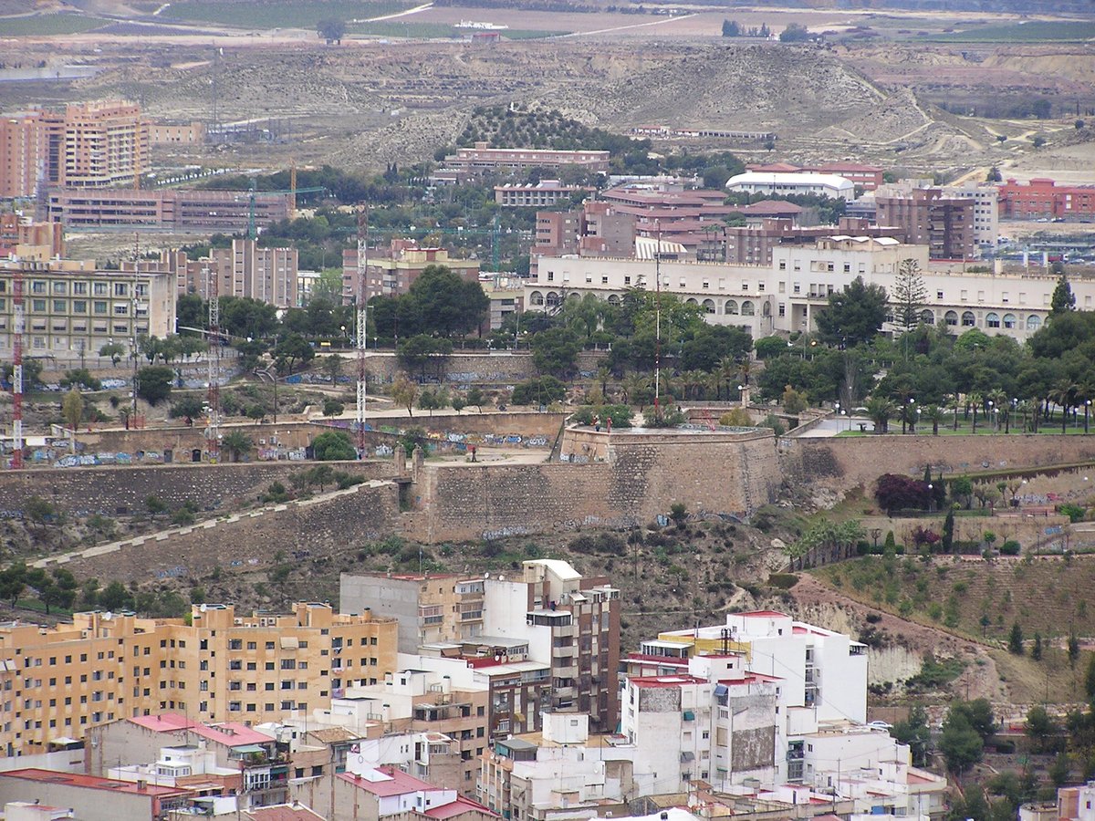 Evening view of Alicante with Castillo San Fernando from Santa Barbara Castle after rain