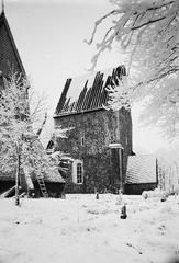Winter view of Gamla Uppsala Church with part of the bell tower in the foreground, southwestern perspective