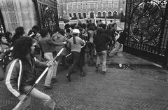 South Moluccan demonstrators clashing and forcing a gate at the Peace Palace in The Hague during protest on December 27, 1974