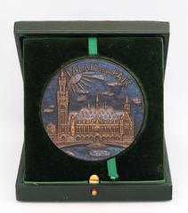 Close-up of a medal featuring the Peace Palace in The Hague, Netherlands