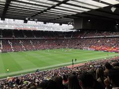 Sir Alex Ferguson standing near the corner flag during a football match