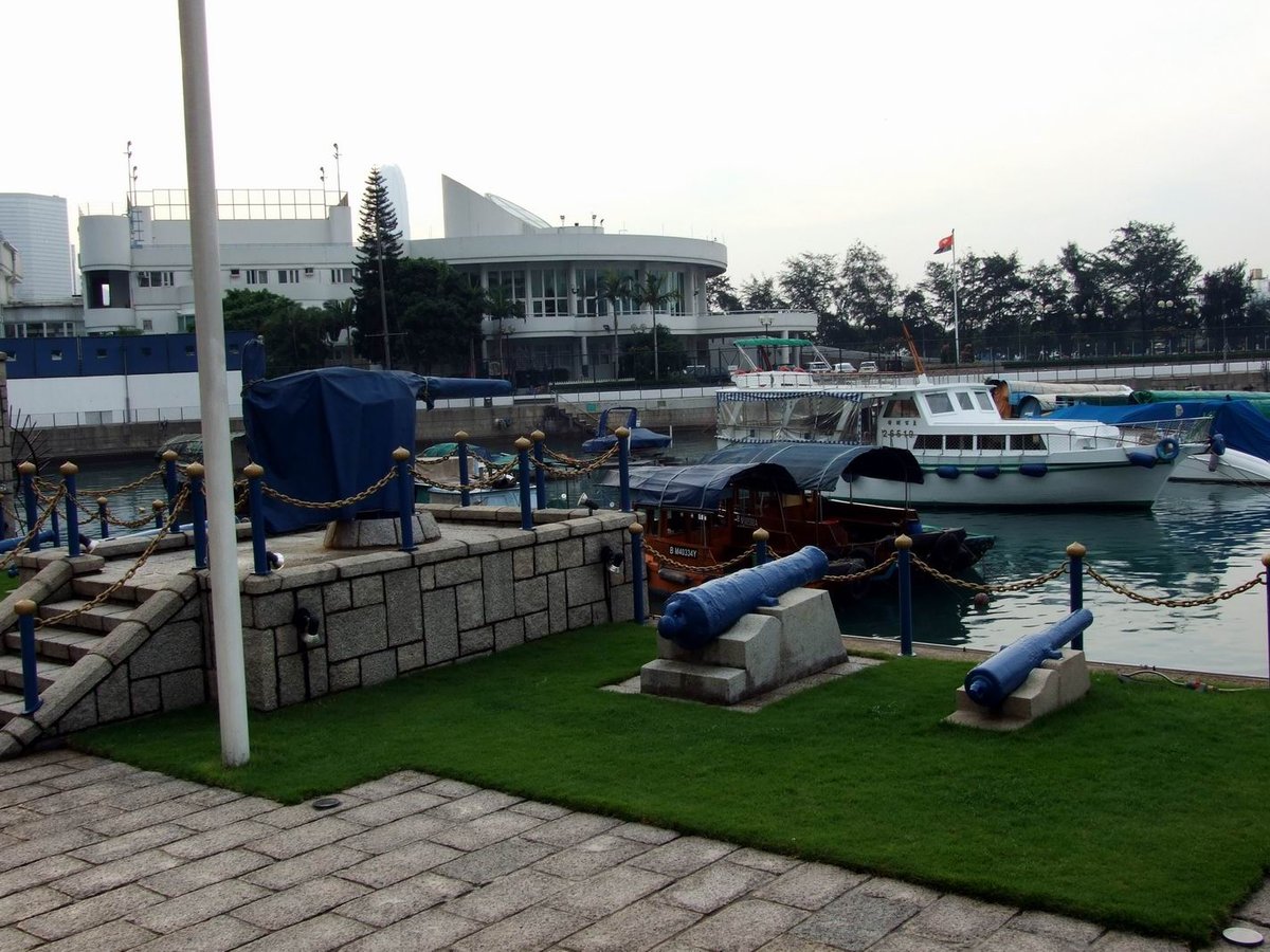 Noonday Gun at Jardine's Hong Kong Wharf with Victoria Harbour and skyline