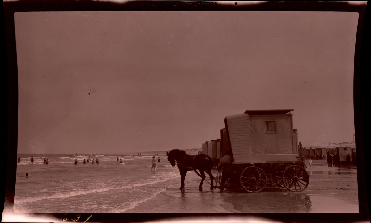 Horse drawn bathing wagon arriving on Scheveningen beach, Netherlands, 1913