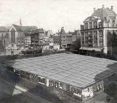 Historical image of Dam Square in Amsterdam with retouched floor heating tiles under construction in 1923 April Fools prank