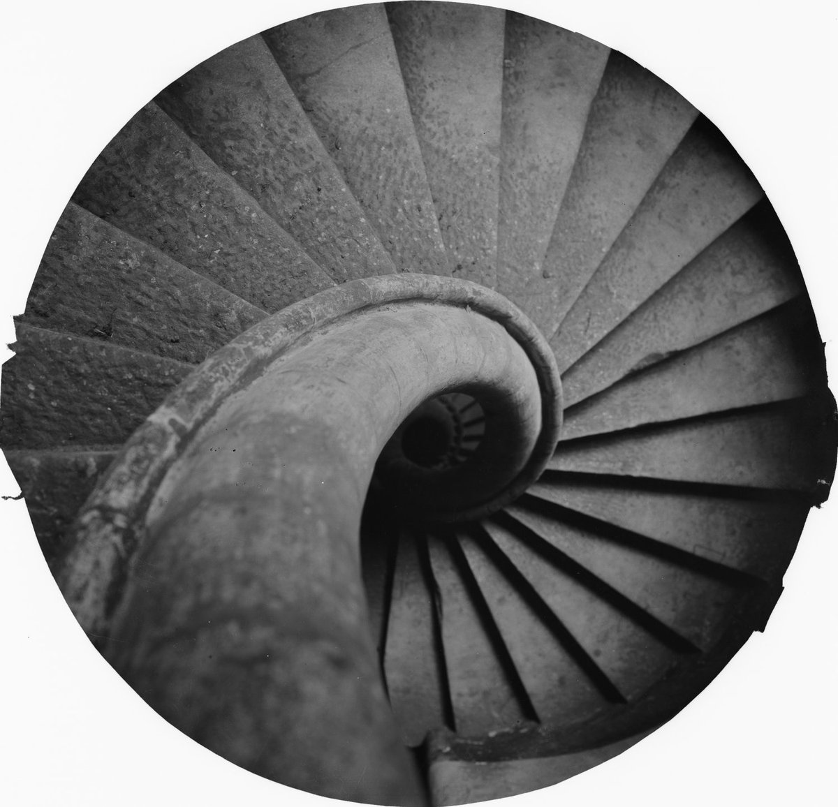 Top-down view of a stone spiral staircase