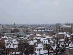 View of Old Lyon covered in snow with the Basilica of Notre-Dame de Fourvière in the background