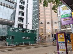 Street view of Des Voeux Road Central and Statue Square Garden in Hong Kong Central with HSBC and Standard Chartered Bank headquarters in September 2024