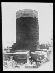 Old architectural tower in Baku, Azerbaijan with scenic urban coastline and sea views under clear sky