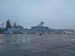 Baneasa Airport terminal building illuminated at evening dusk