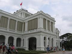 Istana building in Singapore with lush greenery and clear blue sky