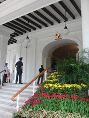 Exterior view of Istana, the official residence and office of the President of Singapore, surrounded by greenery