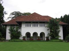 Istana building in Singapore with lush greenery and blue sky