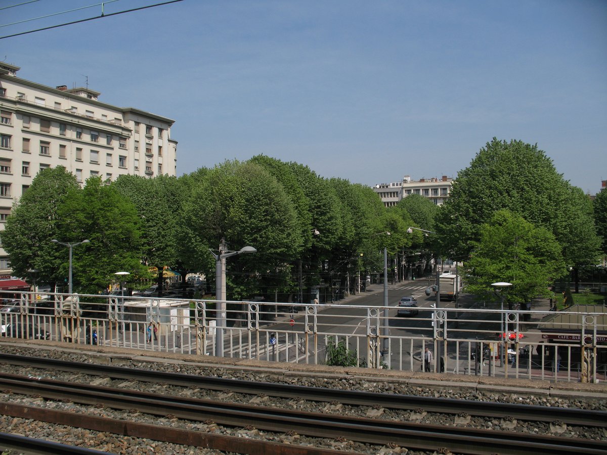 TER Rhône-Alpes train track at Lyon - Jean Macé station with view of Jean Macé square