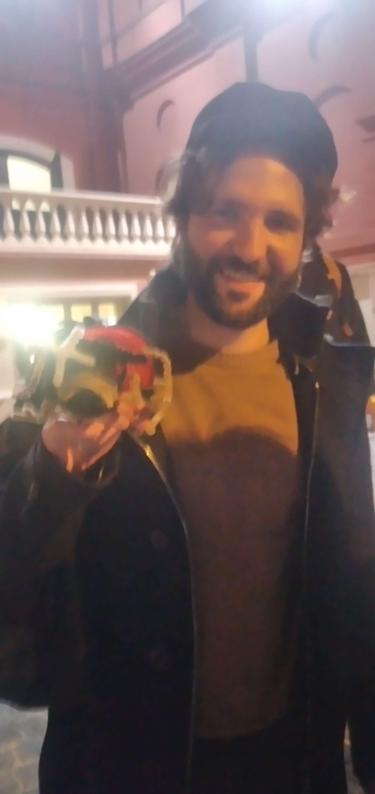 Barbascura X holding a fan's gift after a performance at Teatro Petruzzelli in 2023