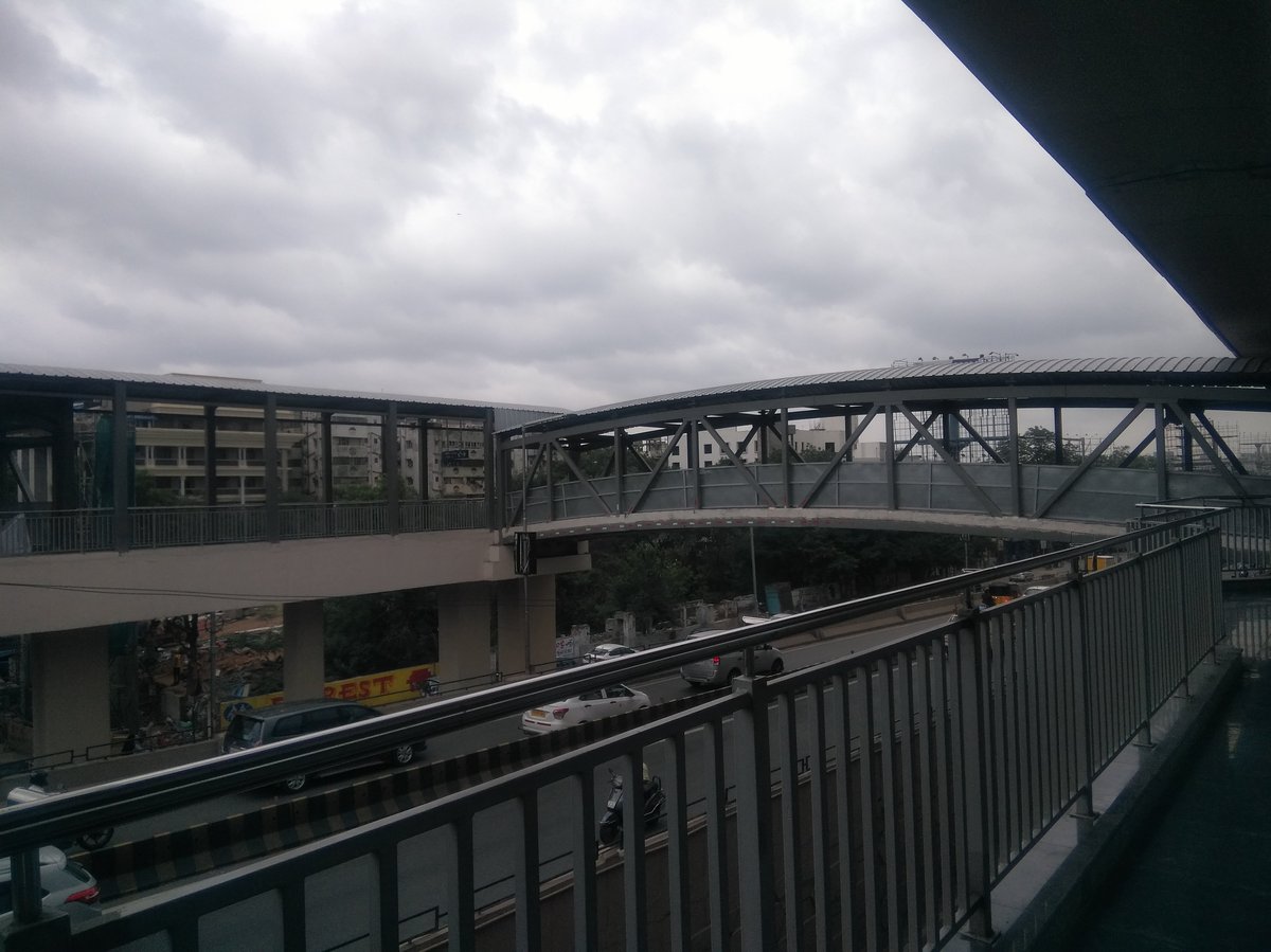 Paradise Metro train at station with overhead cables and blue sky