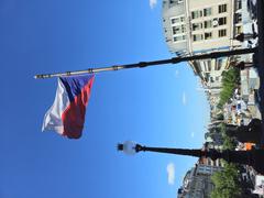 Czech flag fluttering at Wenceslas Square under construction of tram tracks