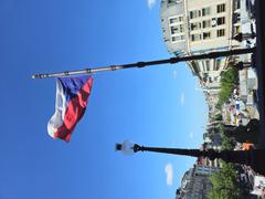 Czech flag at Wenceslas Square with tram track construction
