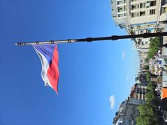 Construction of tram tracks at Wenceslas Square with Czech flag flying above