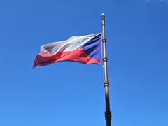 Construction of tram tracks at Wenceslas Square in Prague with Czech flag