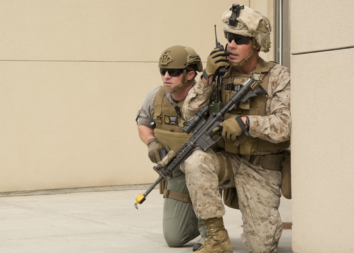 Diplomatic Security Service agents and FASTEUR Marines standing guard during an exercise at the American Embassy in Belgrade, Serbia