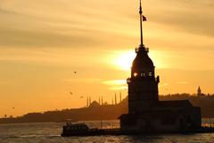 Sunset over the Maiden's Tower in Istanbul with vibrant orange sky