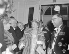 Arrival of Queen Juliana and Prince Bernhard at the Concertgebouw in Amsterdam during a festive evening on April 30, 1962