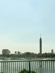 Cairo Tower standing tall on Geizera Island in the Nile River with the city skyline in the background