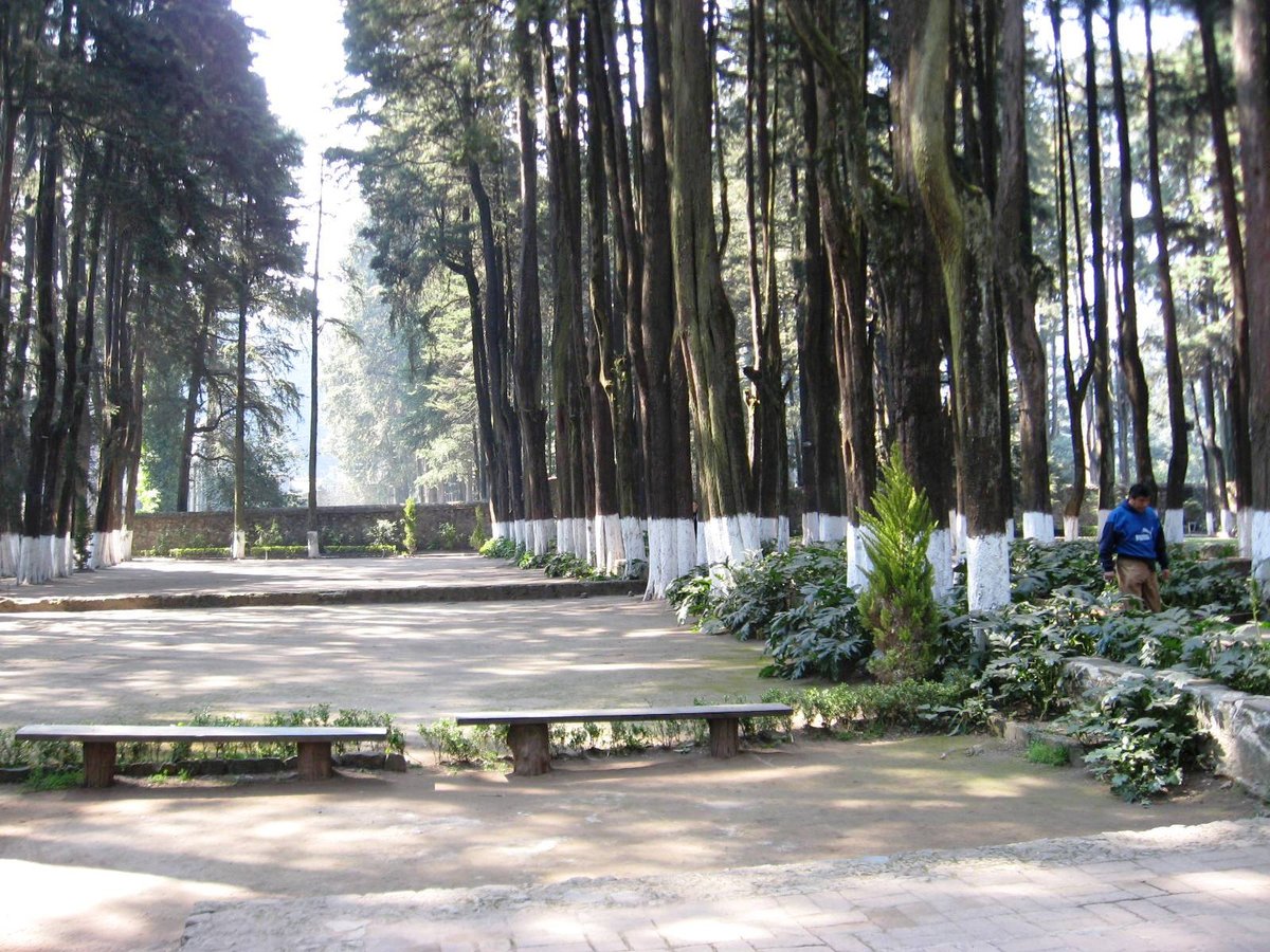 Front courtyard and garden of the former Convent of Desierto de los Leones with empty areas showing original 17th century monastery location in Desierto de los Leones National Park Mexico City