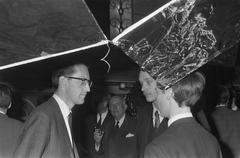 Black and white photo of the 5th Congress of the Social Interacademiale on the student ship Caledonia with alderman Koets in conversation with chairman Winters and others, Amsterdam 1969