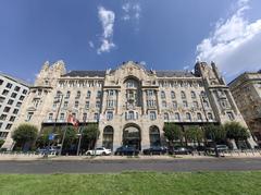 Gresham Palace in Budapest with ornate architectural details and clear blue sky