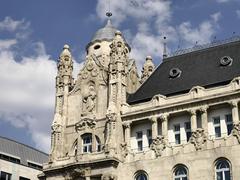Gresham Palace in Budapest with ornate architecture and blue sky