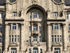 Gresham Palace in Budapest with ornate architecture under a clear blue sky