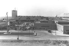 Entrance to the fair ground in Tel Aviv with large archway and people walking in